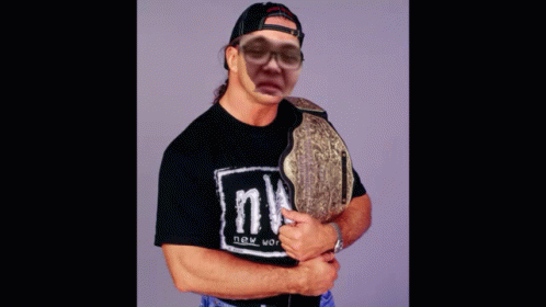 A Man Wearing A Black Shirt That Says Nwo GIF
