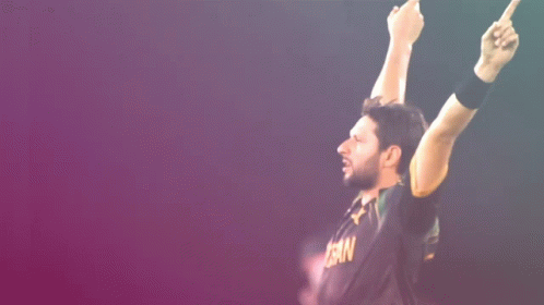 A Man Wearing A Black Shirt That Says ' Pakistan ' On It GIF