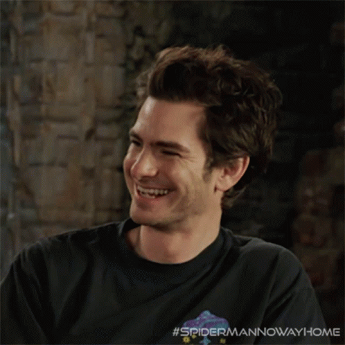 A Man Wearing A Black Shirt That Says #Spidermannowwayhome GIF