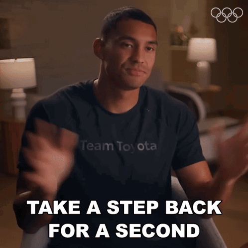 A Man Wearing A Black Shirt That Says Team Toyota GIF
