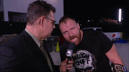 A Man Wearing A Black Shirt That Says Tnt On It GIF