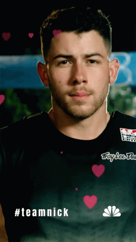 A Man Wearing A Black Shirt That Says Troy Lee Designs On It GIF
