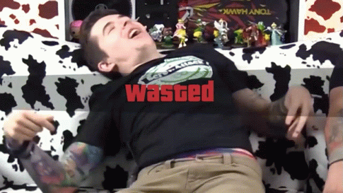 A Man Wearing A Black Shirt That Says " Wasted " On It GIF