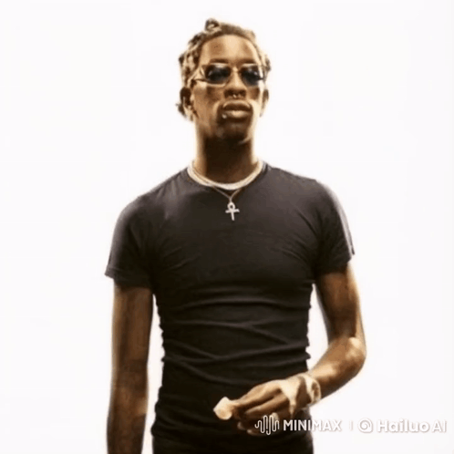 A Man Wearing A Black Shirt With An Ankh Pendant GIF