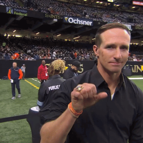 A Man Wearing A Black Shirt With Public Written On It GIF