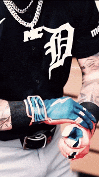 A Man Wearing A Black Shirt With The Letter D On The Front GIF