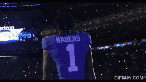 A Man Wearing A Black Shirt With The Number 2 On It GIF