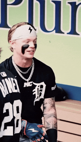 A Man Wearing A Black Shirt With The Number 28 GIF