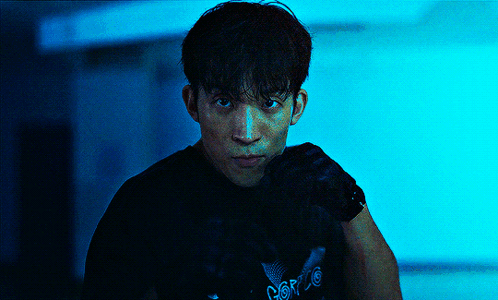 A Man Wearing A Black Shirt With The Word Force On It Looks At The Camera GIF