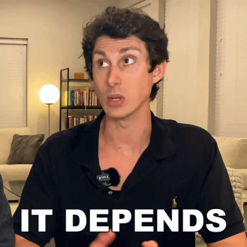 A Man Wearing A Black Shirt With The Word It Depends On His Chest GIF