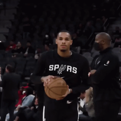 A Man Wearing A Black Shirt With The Word Spurs On It Is Holding A Basketball GIF