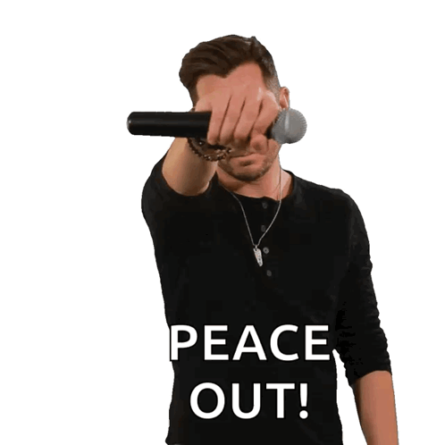 a man wearing a black shirt with the words peace out on it