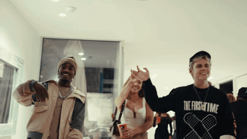 A Man Wearing A Black Sweatshirt That Says The First Time GIF