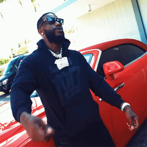 A Man Wearing A Black Sweatshirt With The Number 97 On It GIF