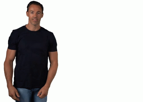 A Man Wearing A Black T-Shirt And Blue Jeans Is Smiling GIF