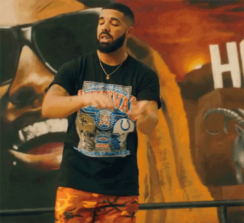 A Man Wearing A Black T-Shirt That Says ' Montana ' On It GIF