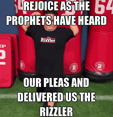 A Man Wearing A Black T-Shirt That Says ' Rejoice As The Prophets Have Heard ' On It GIF