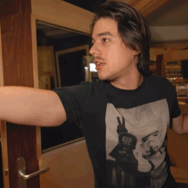 A Man Wearing A Black T-Shirt With A Picture Of A Woman On It GIF