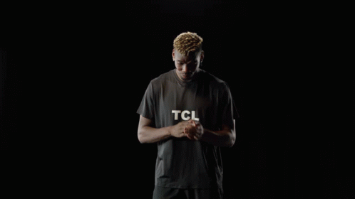 A Man Wearing A Black T-Shirt With The Word Tcl On It GIF