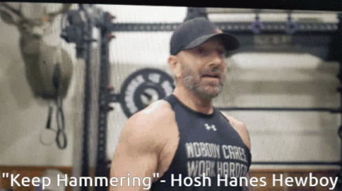 A Man Wearing A Black Tank Top That Says Nobody Cares Work Harder GIF