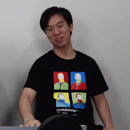 a man wearing a black tchaikovsky shirt