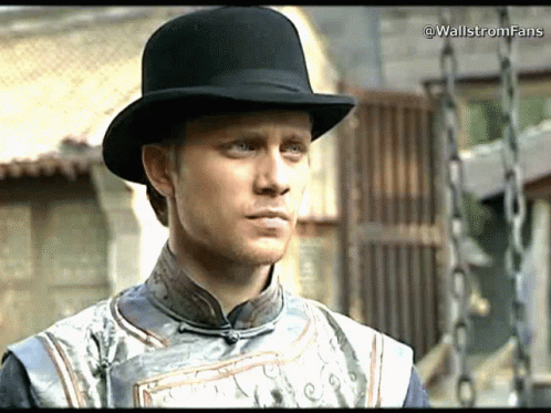 A Man Wearing A Black Top Hat And A Gray Shirt With The Words Wallstromfans Written On The Bottom GIF