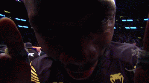 A Man Wearing A Black Ufc Shirt With Crypto.com On It GIF