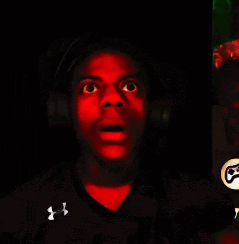 A Man Wearing A Black Under Armour Shirt Is Making A Funny Face GIF