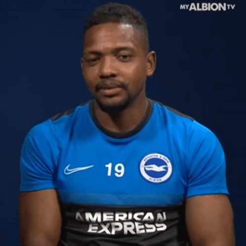 A Man Wearing A Blue American Express Shirt GIF