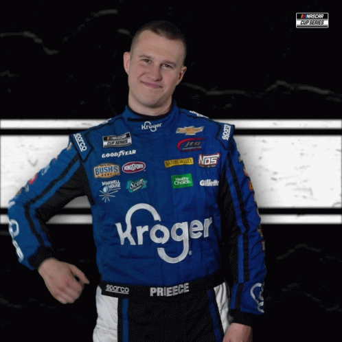 A Man Wearing A Blue And Black Race Suit With Kroger On It GIF