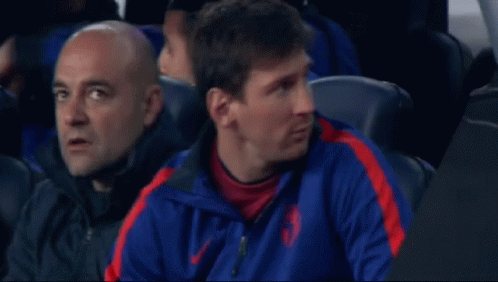 A Man Wearing A Blue And Red Nike Jacket GIF