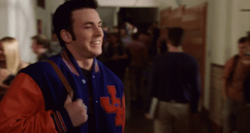 A Man Wearing A Blue And Red Varsity Jacket With The Letter J On It GIF