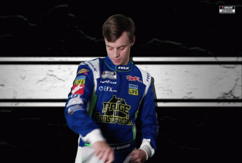 A Man Wearing A Blue And White Jacket With The Word Construction On The Front GIF