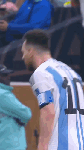 A Man Wearing A Blue And White Jersey With The Number 11 On It GIF