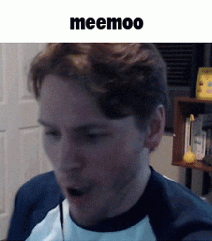 A Man Wearing A Blue And White Shirt Is Talking Into A Microphone With The Word Meemoo Above Him GIF