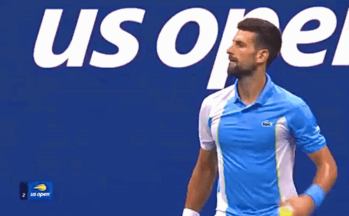 A Man Wearing A Blue And White Shirt With A Lacoste Logo GIF