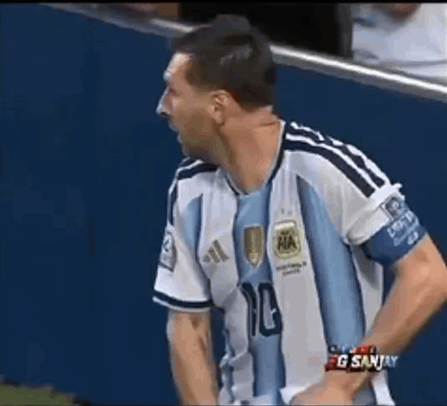 A Man Wearing A Blue And White Soccer Jersey With The Number 10 On It GIF