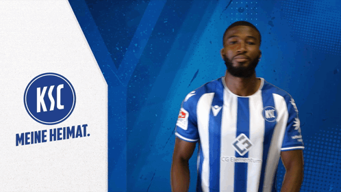 a man wearing a blue and white striped shirt with ksc meine heimat on the bottom