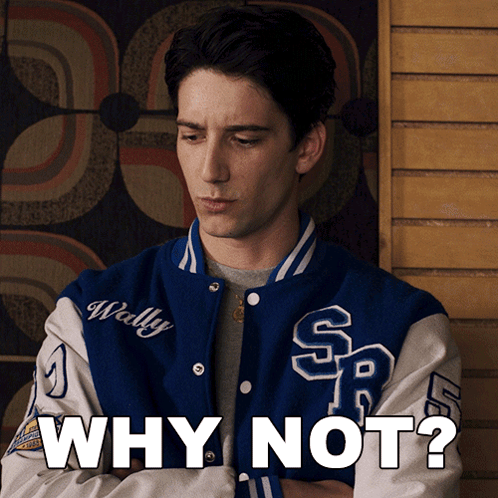 A Man Wearing A Blue And White Varsity Jacket With The Words Why Not On It GIF