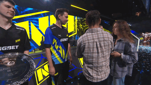 A Man Wearing A Blue And Yellow Shirt With Gg On It GIF