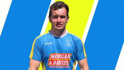 A Man Wearing A Blue And Yellow Shirt With Morgan & Davies On It GIF