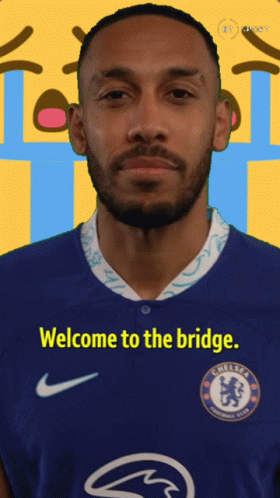 A Man Wearing A Blue Chelsea Jersey With The Words Welcome To The Bridge On It GIF