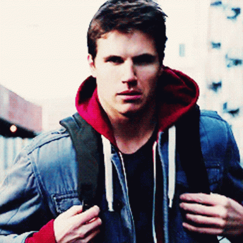 A Man Wearing A Blue Denim Jacket And A Red Hoodie GIF
