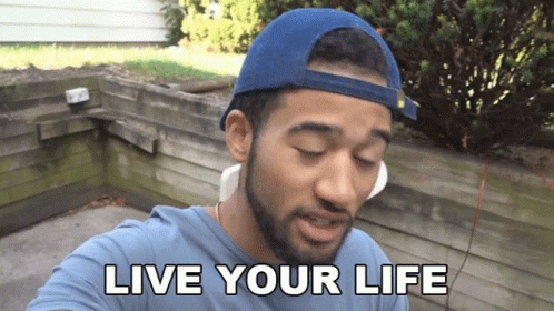 A Man Wearing A Blue Hat And A Blue Shirt Says " Live Your Life " GIF