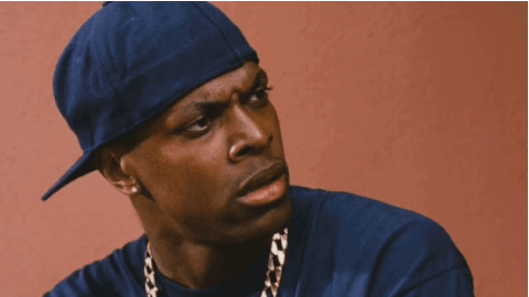 A Man Wearing A Blue Hat And A Gold Chain Is Smoking A Cigarette GIF