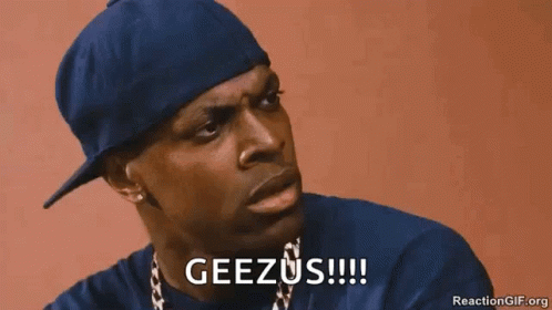 A Man Wearing A Blue Hat And A Necklace Is Saying Geezus . GIF