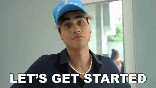 A Man Wearing A Blue Hat And A Pearl Necklace Says " Let 'S Get Started " GIF