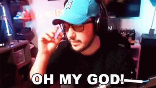A Man Wearing A Blue Hat And Headphones Says Oh My God GIF
