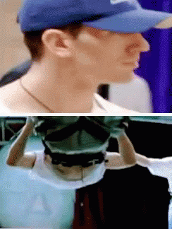 A Man Wearing A Blue Hat Has The Letter A On The Front Of His Shirt GIF