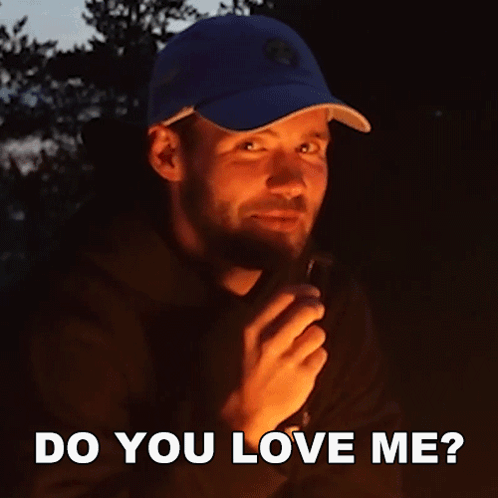 Man In Blue Hat Holding Lighter Do You Love Me GIF